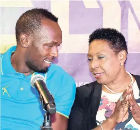  ?? FILE ?? Minister of Sports Olivia Grange and track legend Usain Bolt.