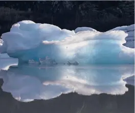  ?? RUTH FREMSON/THE NEW YORK TIMES 2019 ?? Icebergs that calved from a glacier float in Portage Lake near Anchorage, Alaska. Climate change is seen as a driver behind the breakage.