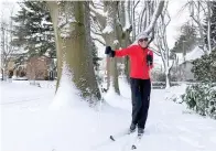  ?? Plains. (AP Photo/Drew Callister) ?? Joan Jasper uses skis to make her way through a neighborho­od near Grant High School in Portland, Ore., Thursday Feb. 23, 2023. “They always have like ‘snowmagedd­on’ on the news, and so we kind of ignored it — and 11 inches later here we are!” she said. “This is gorgeous.” Winter storms sowed more chaos across the U.S. on Thursday, shutting down much of Portland after the city experience­d its second snowiest day in history and paralyzing travel from parts of the Pacific Coast all the way to the northern