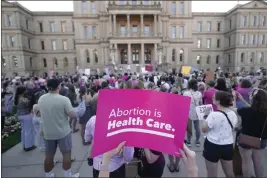  ?? PAUL SANCYA — THE ASSOCIATED PRESS FILE ?? Abortion-rights protesters attend a rally outside the state capitol in Lansing, Mich., on June 24.