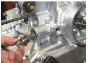  ??  ?? 16
Refit the oil pressure relief valve, adding engine oil to its piston. Use a new copper washer. Tighten the relief valve by hand using a 17mm spanner or socket – there’s no official torque setting.