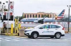  ?? ?? An American Airlines flight was evacuated Saturday after emergency landing at LaGuardia. The “emergency” was a false alarm, and passenger deemed suspicious got an all-clear after being detained for several hours.