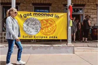  ?? Sam Owens/staff photograph­er ?? A sign about Monday’s eclipse hangs outside the Good Art Company art gallery in downtown Fredericks­burg on Sunday. Officials there prepared for years for the total solar eclipse.