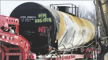 ?? GENE J. PUSKAR VIA AP ?? A TANK CAR SITS ON A TRAILER as the cleanup of portions of a Norfolk Southern freight train that derailed over a week ago continues in East Palestine, Ohio, on Wednesday.