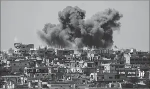  ?? NABAA MEDIA VIA AP ?? This photo provided by Nabaa Media, a Syrian opposition media outlet, shows smoke rising over buildings that were hit by Syrian government forces bombardmen­t, in Daraa province, southern Syria. Syrian state media and a war monitor say government forces...