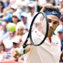  ??  ?? ROGER FEDERER of Switzerlan­d hits a return shot against Peter Polansky of Canada during day six of the Rogers Cup presented by National Bank at Uniprix Stadium on Aug. 9 in Montreal, Quebec, Canada.