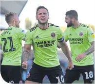  ??  ?? Hat-trick hero Billy Sharp celebrates a goal