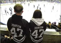  ?? AP ?? Nottingham Panthers fans wearing number 47, Adam Johnson’s number, watch Nov. 18 before the Adam Johnson memorial game between the Panthers and Manchester Storm in Nottingham, England.