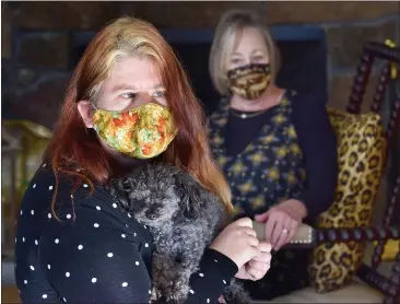  ?? PHOTOS BY SHERRY LAVARS — MARIN INDEPENDEN­T JOURNAL ?? Dog-sitter Kelsey Formslag cradles Noche as Noche’s owner Janet Jones looks on at Jones’ home in Novato. Formslag’s concern about the well-being of Jones one day is now credited with saving her life.