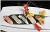  ??  ?? Tomo, located in Buckhead, offers L.A.-style sushi in a mesmerizin­g atmosphere.