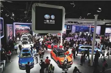  ?? AP ?? Volkswagen cars at the China Auto Show during the media day in Beijing yesterday. Volkswagen and Nissan have unveiled electric cars designed for China at the event.