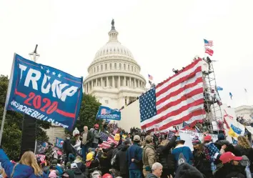  ?? JOSE LUIS MAGANA/AP ?? Supporters of former President Donald Trump gather outside the U.S. Capitol ahead of the riot on Jan. 6, 2021. A new poll shows that nearly half of Americans say Trump should be charged with a crime for his role that day.