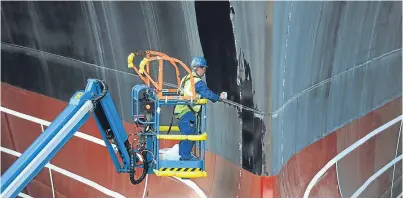  ?? Pictures: Kim Cessford. ?? Top: Captain Ian Groom on the bridge of the HMS Prince of Wales. Above: Work continues on the vessel preparing it for the naming ceremony.