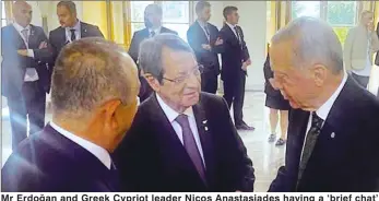  ?? ?? Mr Erdoğan and Greek Cypriot leader Nicos Anastasiad­es having a ‘brief chat’ on the sidelines of the European Political Community meeting