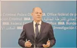  ?? FOTO: REUTERS ?? El canciller alemán Olaf Scholz, ayer en conferenci­a de prensa, durante su vista a la oficina de la policía federal de Alemania en Wiesbaden.