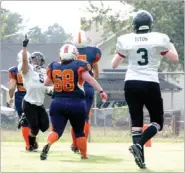  ??  ?? Pointing toward heaven. Alesha Carr, of Fayettevil­le, commemorat­es a touchdown in the Arkansas Lady Rampage’s, 22-12, win over the Kansas Phoenix, at the Lincoln High School football field on Saturday. Carr had a pair of scores from intercepti­ons during the contest and dedicated the game to her father, Earnest, who was taken off life support on Saturday and passed away Sunday.