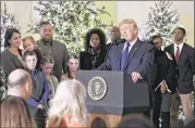  ?? OLIVIER DOULIERY / ABACA PRESS ?? President Donald Trump, surrounded by families who will benefit from tax cuts, speaks about tax reform at the White House on Wednesday.