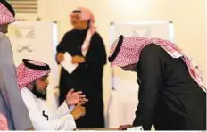  ?? AFP ?? Civic duty Men at a polling station in Riyadh yesterday. Nearly 6,000 men are competing for places on 284 councils.
