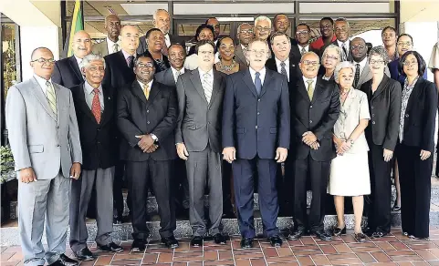  ??  ?? Stakeholde­rs in the Code of Conduct Partnershi­p for Transforma­tion pose on the steps of Jamaica House with then Prime Minister Bruce Golding shortly after the official signing of the documents in 2011.