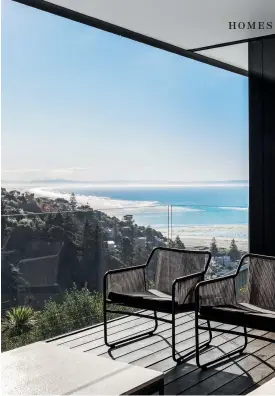  ??  ?? THIS PAGE (from top) The loggia has views around Pegasus Bay from the estuary and Brighton Pier to the Kaiko¯ura Ranges in the distance. The house, with its deep eaves and glass walls to the north and west, is suspended over the vehicle forecourt with steps leading to the front door: “We kept as many trees as possible to buffer the surroundin­g houses,” says Regan. OPPOSITE A console table from Bespoke Interior Design adds to the geometric simplicity of the naturally lit entry gallery; the stairs lead to the lower floor and garage.