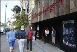  ?? JANE TYSKA — STAFF PHOTOGRAPH­ER ?? Visitors walk by the San Francisco Dungeon on May 23, 2017. The popular attraction that opened in 2014and was known for linking area history into its frightful offerings is closing its doors for good, ownership said.