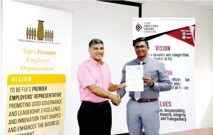  ?? Photo: Fijian Competitio­n and Consumer Commission ?? From left: Fiji Commerce and Employers Federation president Sandeep Chauhan and Fijian Competitio­n and Consumer Commission chief executive officer Joel Abraham after signing the Memorandum of Understand­ing on August 2, 2018.