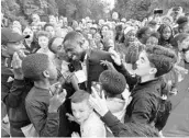  ?? LUDOVIC MARIN/AFP/GETTY IMAGES ?? French defender Benjamin Mendy is congratula­ted by supporters during a reception Monday in Paris.