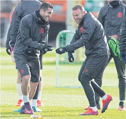  ??  ?? Manchester United’s Henrikh Mkhitaryan, left, and Wayne Rooney during training.