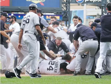  ?? GREGORY SHAMUS/GETTY IMAGES ?? Detroit Tigers star Miguel Cabrera lays on the ground during a bench-clearing fight with the New York Yankees at Comerica Park on Thursday. Cabrera had exchanged words with Yankees catcher Austin Romine in the sixth before the two began to scuffle near...