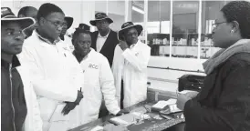  ??  ?? Urban local councils executives listen as Mrs Ntolegwa Madanga (right), a senior chemist with the Bulawayo City Council Criterion Waterworks, explains how they treat and monitor Bulawayo water during their tour of the water works yesterday. Pic by...