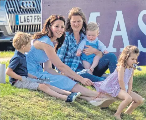  ??  ?? PRINCE George and Princess Charlotte enjoy fun in the sun with their mother, above, as their father played polo.
The Duke of Cambridge was taking part in the Maserati Royal Charity Polo Trophy at Beaufort Polo Club in Tetbury, Gloucester­shire,...