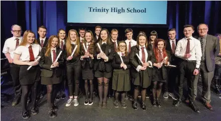  ??  ?? Well done Depute chair of South Lanarkshir­e education resources Councillor Brian McKenna, right, with Trinity High’s Duke of Edinburgh’s Award recipients