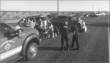  ?? LOANED PHOTO/ SOMERTON COCOPAH FIRE DEPARTMENT ?? SOMERTON/COCOPAH FIRE DEPARTMENT PARAMEDICS ATTEND to the drivers of two vehicles that were involved in a rear-end collision at South Avenue B and County 21st Street.