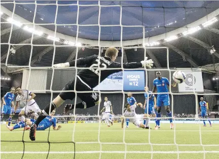  ?? PAU L C H I A S S O N / T H E C A NA D I A N P R E S S ?? The ball gets past Impact goalkeeper Eric Kronberg on a goal by Orlando’s Kaka on Saturday in Montreal.