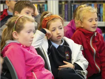  ??  ?? Pupils from Rathnure NS Kate Higgins, Amber Reilly and Orlaith Morrissey enjoying the Surprising Science event at New Ross library.
