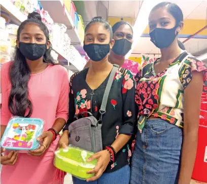  ?? Photo: Laiseana Nasiga ?? Back to school shopping...From left: Ritika Prasad, mother Renuka Prasad (back), Seemran Prasad and Ritisha Prasad.