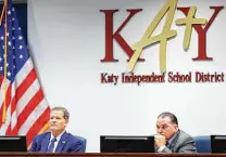  ?? Michael Wyke / Contributo­r ?? Greg Schulte, left, president of the Katy ISD board, and Superinten­dent Ken Gregorski listens to speakers Monday.