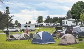  ?? Catherine Avalone / Hearst Connecticu­t Media file photo ?? Campers set up screen tents at their site during Memorial Weekend at Hammonasse­t Beach State Park in Madison in 2017. The state will keep its campground­s at the park and elsewhere closed until at least June 11.