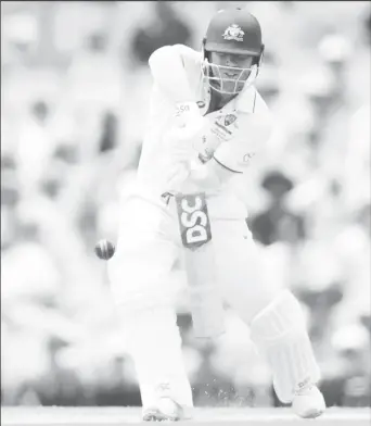  ?? ?? David Warner defends during his possible final test innings as he scored 34 before being dismissed by Salman Ali Agha