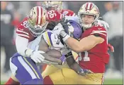  ?? JOSE CARLOS FAJARDO — BAY AREA NEWS GROUP FILE ?? The San Francisco 49ers’ DeForest Buckner (99) and Nick Bosa (97) tackle the Minnesota Vikings’ Dalvin Cook (33) in the third quarter of an NFC divisional playoff game at Levi’s Stadium in Santa Clara on Jan. 11, 2020.