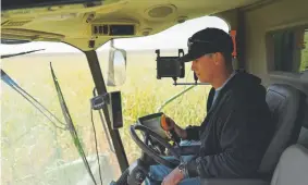  ?? RJ Sangosti, Denver Post file ?? Jeremy Fix drives a combine during corn harvest in September at his family’s farm in Wray. Colorado farmers had been waiting for Congress to pass a farm bill, which the House approved Wednesday. The legislatio­n now awaits President Donald Trump’s signature.