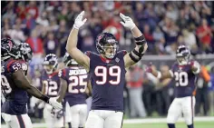  ?? AP Photo/David J. Phillip, File ?? ■ Houston Texans defensive end J.J. Watt (99) gestures during the first half of an NFL football game Nov. 26 against the Tennessee Titans in Houston. Houston went 0-3, yet not has become the first team to win eight straight after such a weak start.