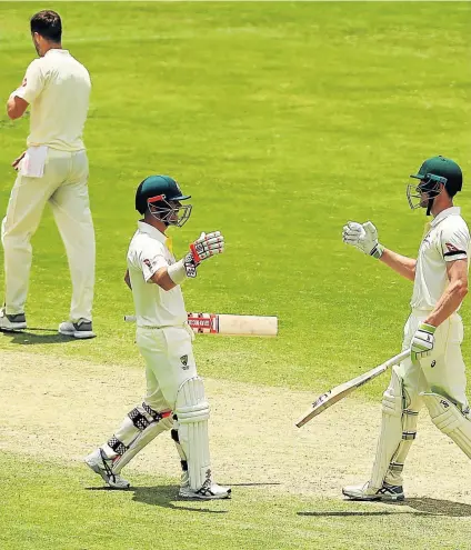  ?? Picture: GETTY IMAGES ?? DONE AND DUSTED: David Warner and Cameron Bancroft of Australia show their delight at a job well done after winning the first Test of the Ashes series against England at the Gabba in Brisbane, Australia yesterday