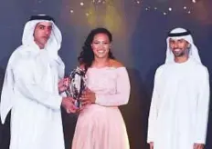  ?? Ahmed Kutty/Gulf News ?? ■ Shaikh Saif presenting the trophy to Larissa Paes for the best Female player of the year award with Suhail Bin Mohammad Faraj Al Mazroui, Minister of Energy and Industry.