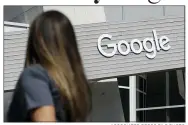  ?? ASSOCIATED PRESS FILE PHOTO ?? A woman walks below a Google sign on the campus in Mountain View, Calif.