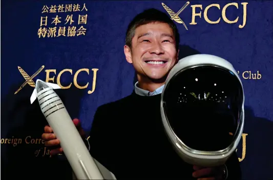  ?? Photo: AFP ?? Yusaku Maezawa, SpaceX BFR’s first private passenger, poses with a miniature rocket and space helmet prior to the start of a press conference at the Foreign Correspond­ents’ Club of Japan in Tokyo on Tuesday.