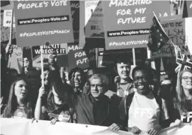  ?? YUI MOK/PA VIA AP ?? Mayor of London Sadiq Khan, center, holds an air horn, as he joins protesters in the People’s Vote March for the Future, in London, on Saturday. Thousands of protesters marched through central London, Saturday, to demand a new referendum on Britain’s Brexit departure from the European Union.