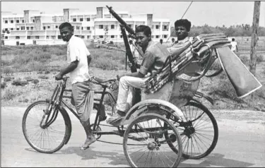  ?? (File Photo/AP) ?? Armed East Pakistan fighters head for the battle front by pedicab April 2, 1971, in Jessore, East Pakistan. The town, near the border with India, was the scene of fierce fighting between East Pakistan followers of Bengali nationalis­t leader Sheikh Mujibur Rahman and Pakistan Army forces.