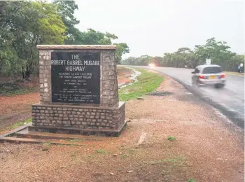  ?? Pictures: AFP ?? WHAT’S IN A NAME? A car travels along a highway named after former Zimbabwean president Robert Mugabe.