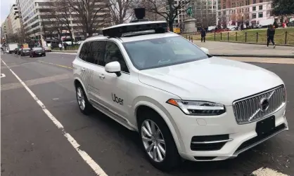  ?? Photograph: Eric Baradat/AFP via Getty Images ?? An Uber car equipped with cameras and sensors drives the streets of Washington DC.